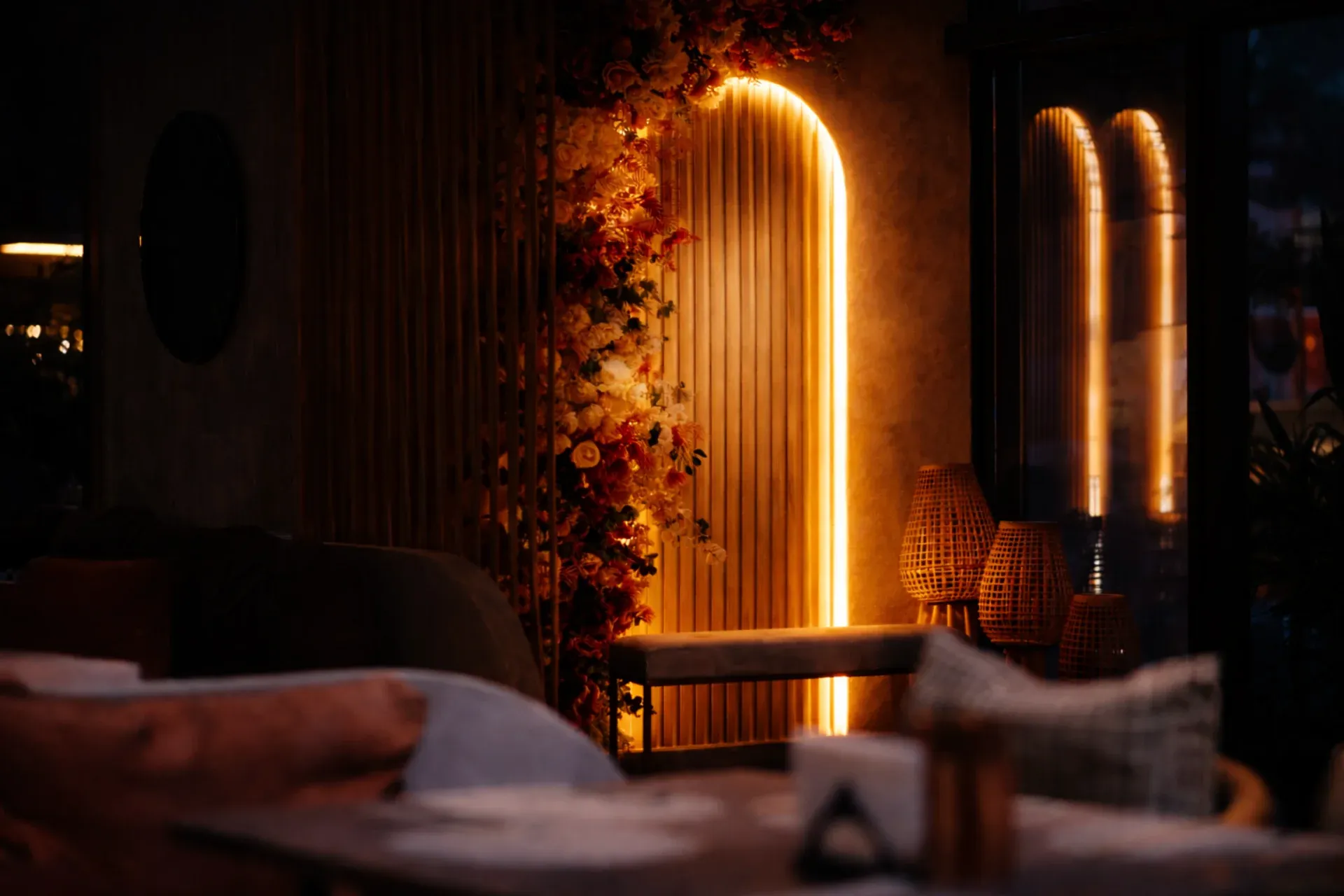 Ambra Restaurant Interior with warm amber lighting and natural textures
